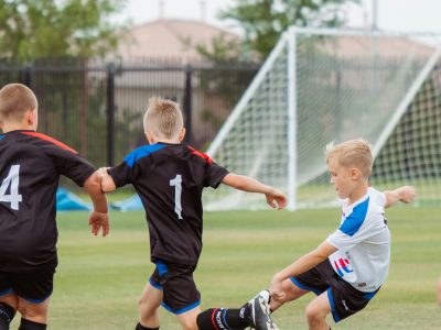 young boys playing football
